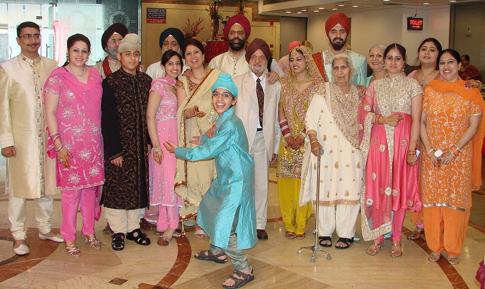 Punjabi family guests in wedding attire, South Asian wedding
