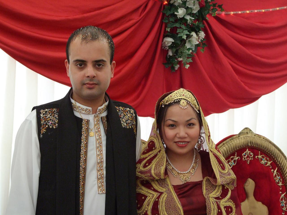 Bride and groom in South Asian wedding clothing at a Muslim nikah ceremony